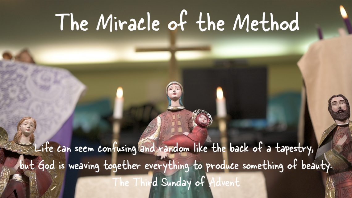 Figurine of Mary Holding Jesus before a large brass Cross