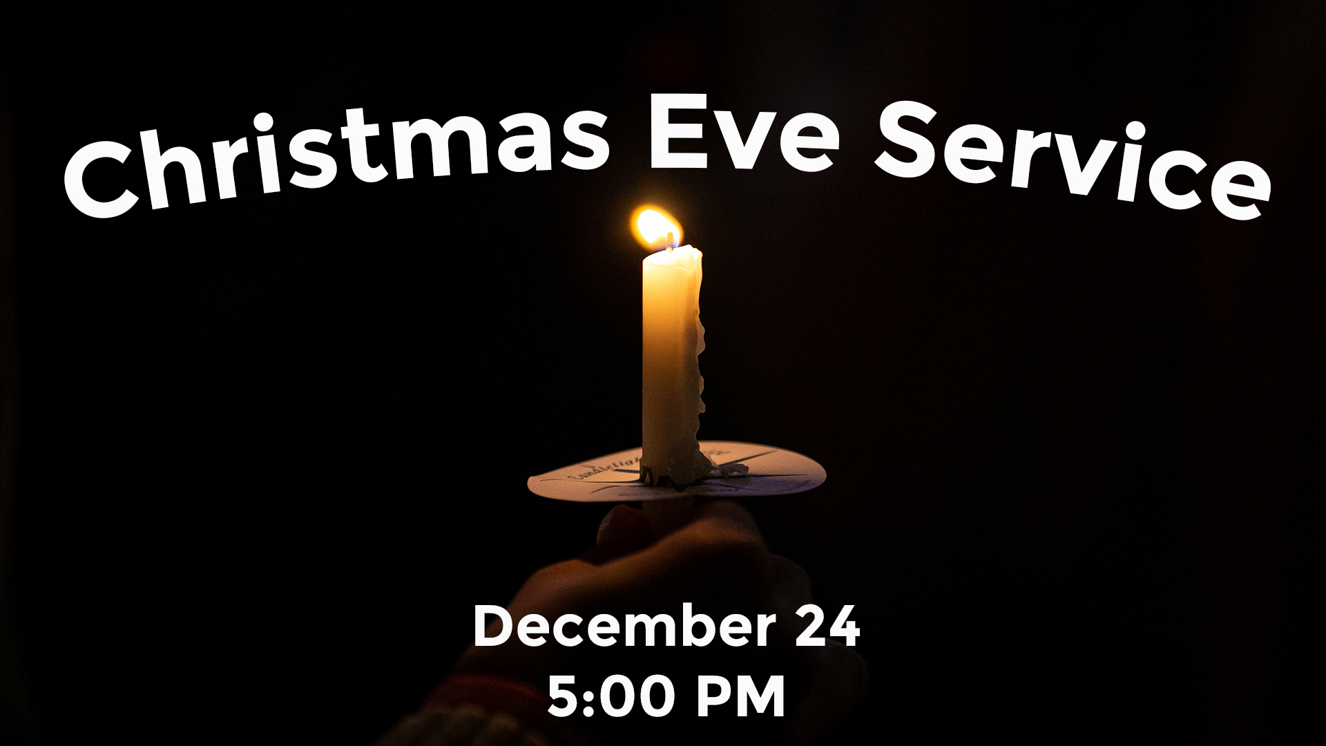 A single candle glowing in darkness with the title "Christmas Eve Service" with the day of Decmeber 24 and the time of 5 PM